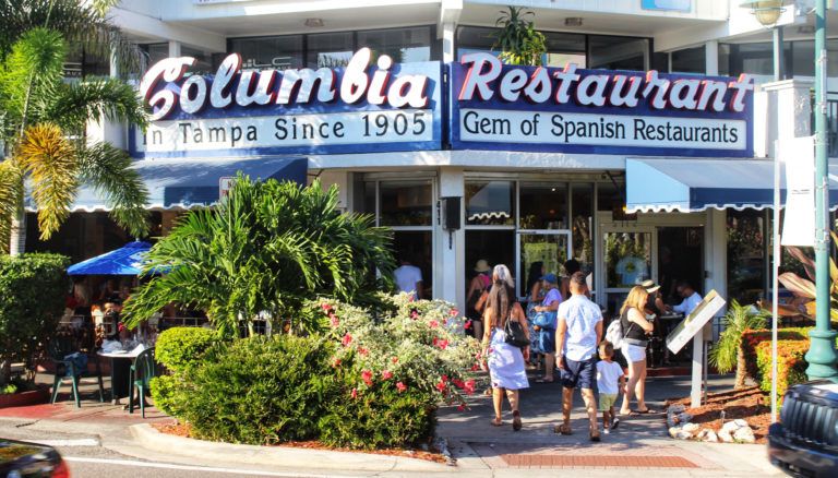 Columbia Sarasota Exterior with sign and people and sidewalks
