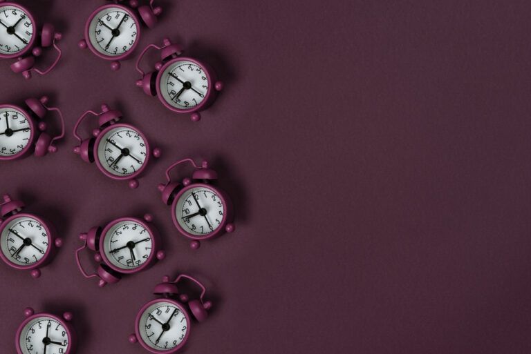 Clocks on pink background