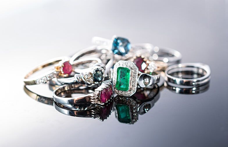 Rings with precious stones and diamonds on isolated background