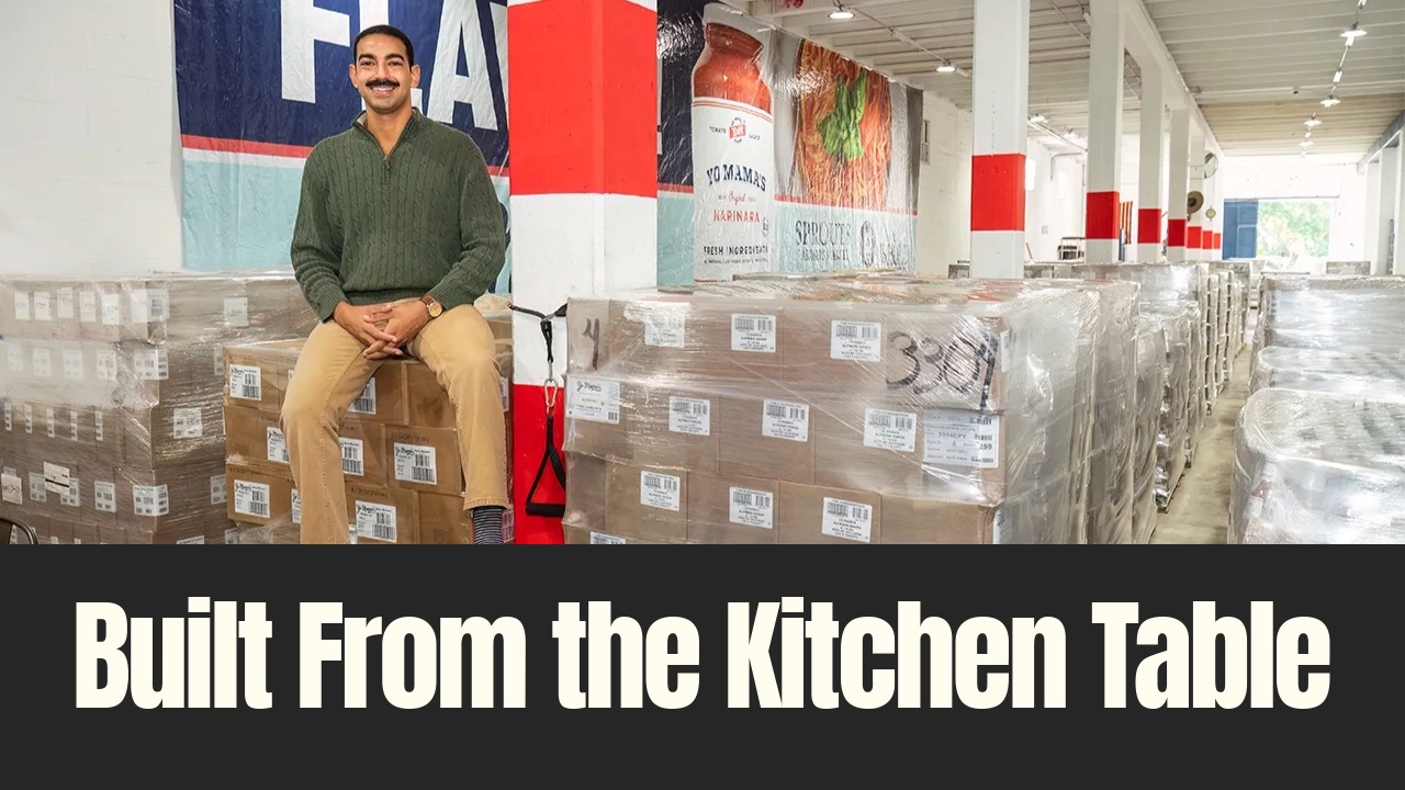 Yo Mama’s Foods founder David Habib sits among pallets of packaged sauces inside the company’s Clearwater warehouse