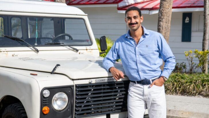 Yo Mama’s Foods founder David Habib stands beside a vintage Land Rover outside a Clearwater property