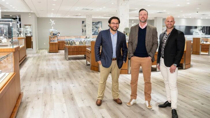 Brian Leclerc, Brian Stamey and Chad Masters standing inside an International Diamond Center showroom