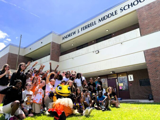 PHOTO - Sun mascot Solé poses with students - credit Tampa Bay Sun Foundation