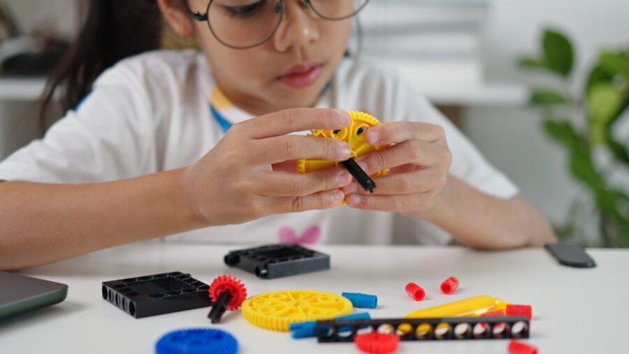 STEM education concept. Asian home school girls self-study online lessons and are excited to make STEM toys. mathematics engineering science technology computer code in robotics for kids' concepts.