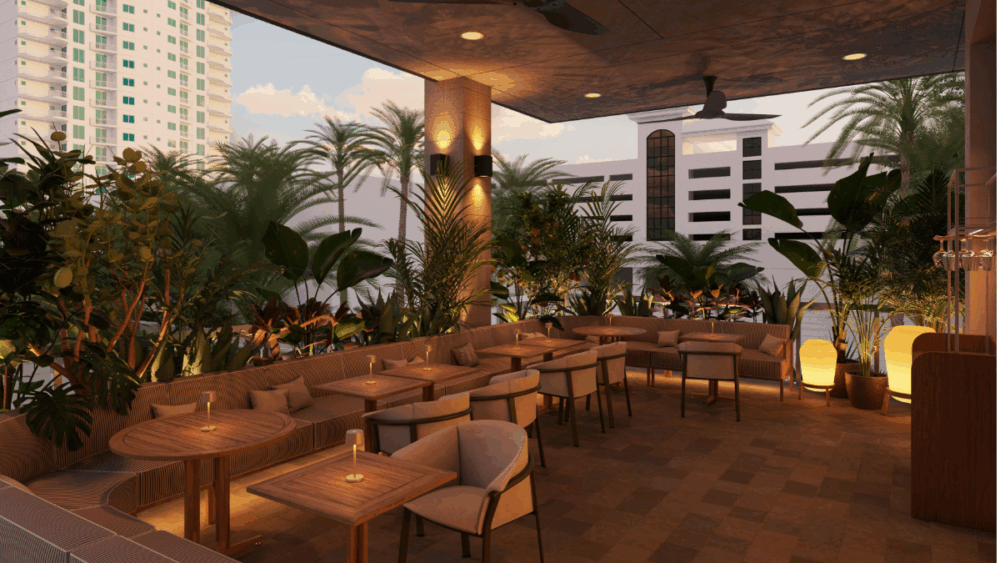 Outdoor patio at Forbici Sundial with greenery and city views.
