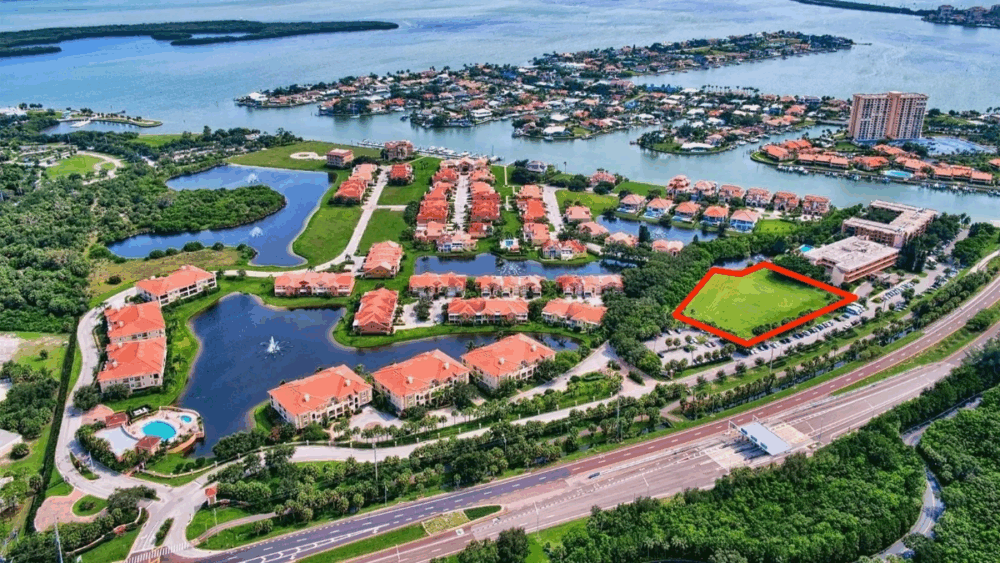 Aerial view of the Marina Bay community in St. Petersburg with the last undeveloped parcel along the Pinellas Bayway highlighted in red.