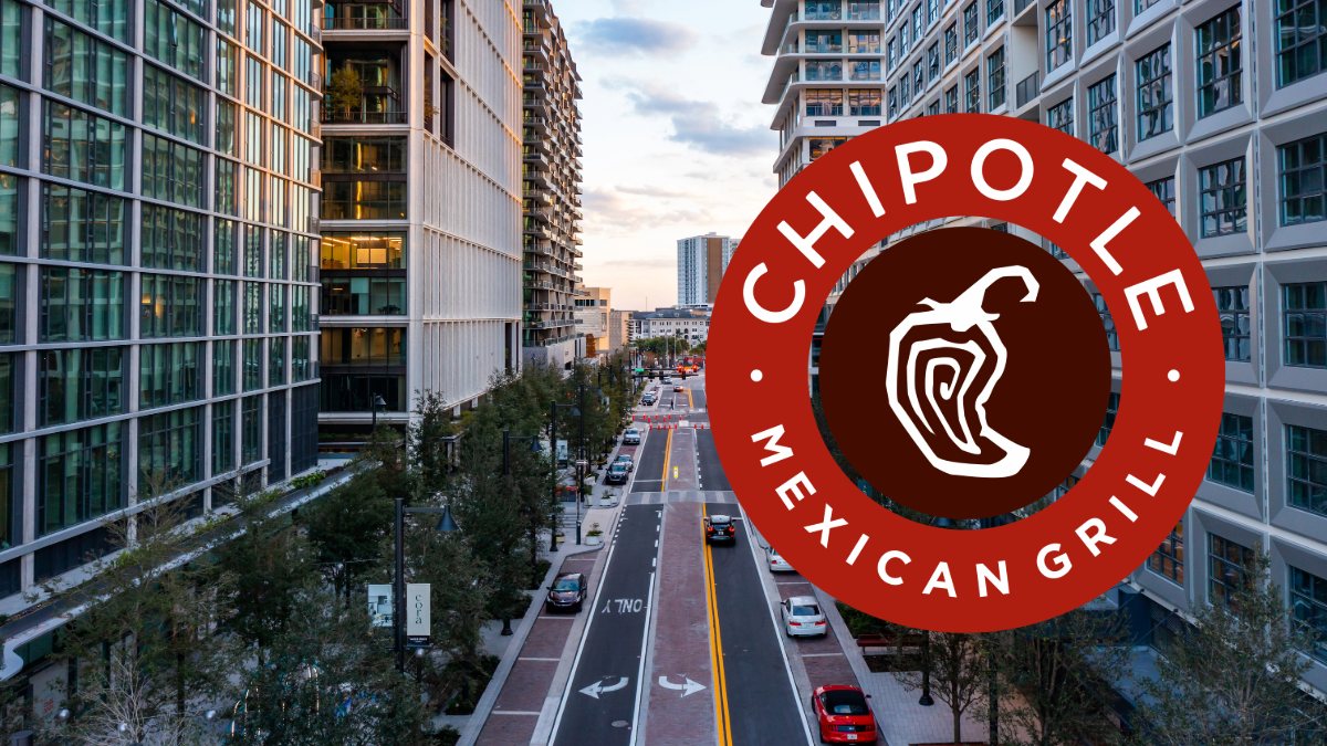 Street view of Water Street Tampa with high-rise buildings at sunset, overlaid with the Chipotle Mexican Grill logo.