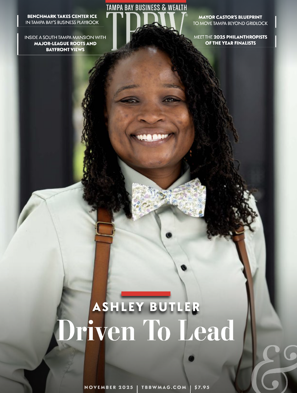Tampa Bay Business & Wealth November 2025 cover featuring Ashley Butler smiling confidently in a light shirt and floral bow tie, titled “Driven To Lead.”