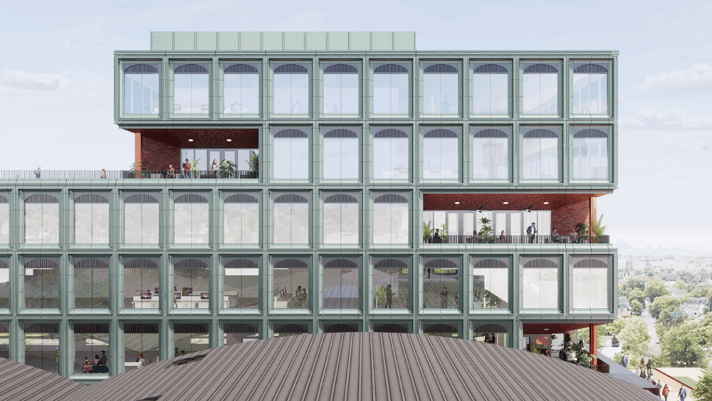 Rendering of the Gasworx office tower in Ybor City showing its modern glass façade, arched windows, and outdoor terrace levels overlooking Tampa.