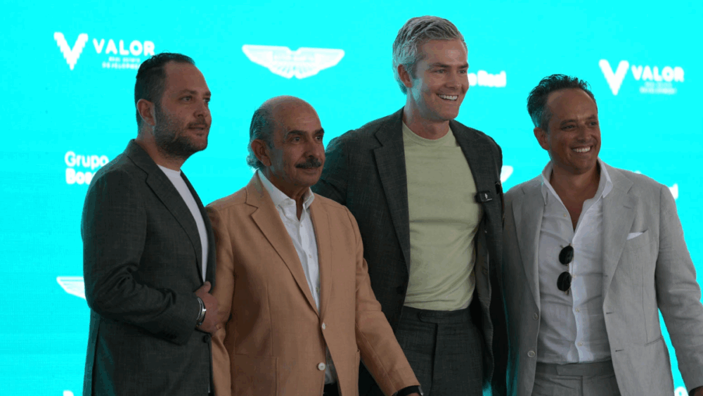 Ryan Serhant stands with real estate and development leaders during the Aston Martin Residences announcement in Mexico City.