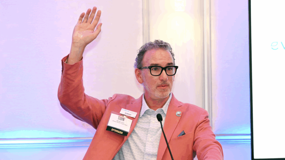 A speaker addressing attendees during the CEO Connect event focused on Tampa leadership and community impact.