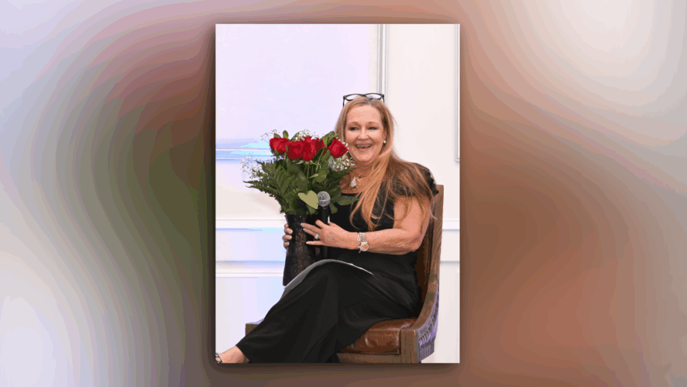 Bridgette Bello holds flowers after Tampa leadership discussion at CEO Connect.