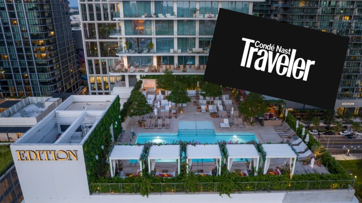 Aerial view of The Tampa Edition rooftop pool and terrace in Water Street Tampa, with the Condé Nast Traveler logo highlighting the hotel’s Readers’ Choice Awards recognition.