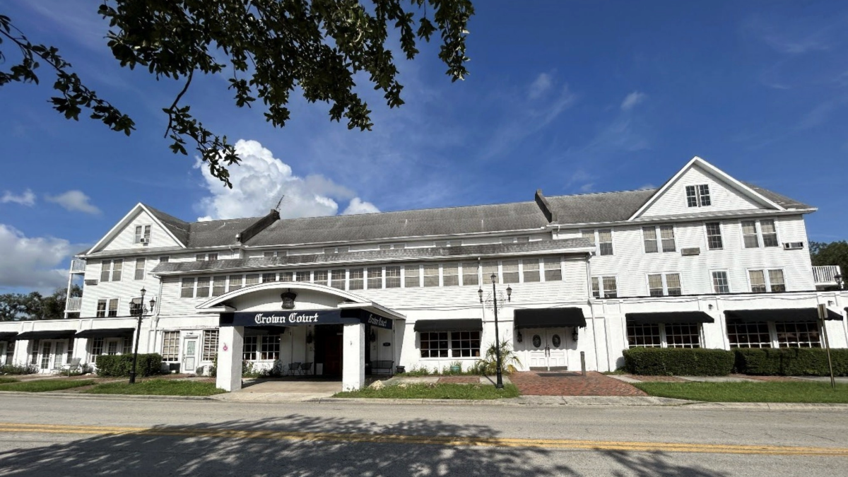 Front exterior view of Crown Court senior housing facility in Inverness, Florida, a historic 120-year-old building set for renovations after its $3.7 million sale.