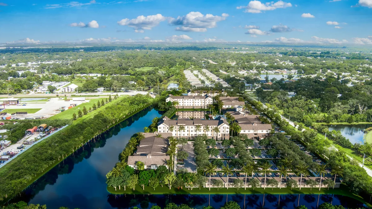 Aerial rendering of Alton Sarasota apartment community surrounded by water and greenery.