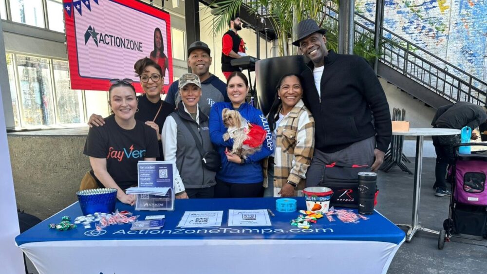Action Zone members celebrate during the Veterans Florida Expo in Tampa.