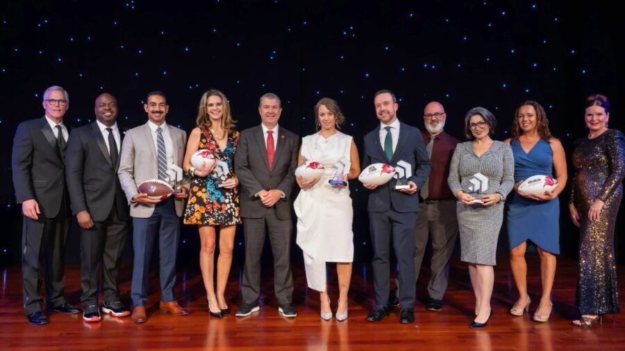 Group photo of the 2025 Tampa Bay Chamber Small Business of the Year Award winners and Chamber leadership posing on stage at the Straz Center in Tampa.