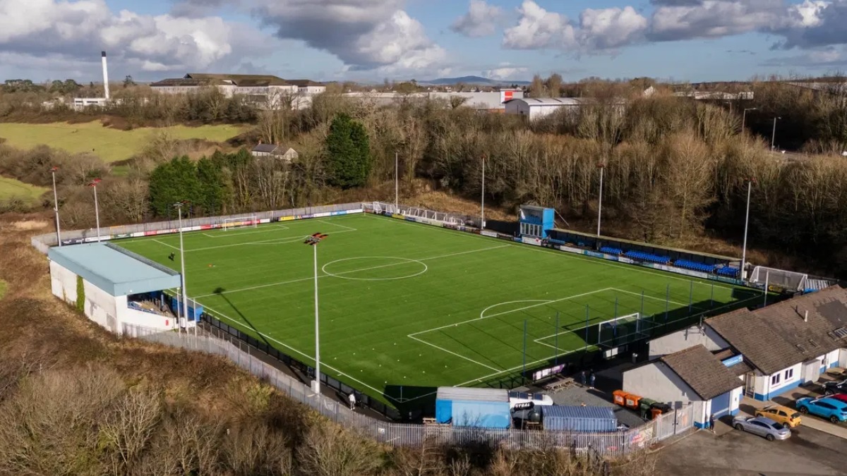 Haverfordwest County AFC soccer players in blue jerseys on the field during a Cymru Premier league match in Wales.
