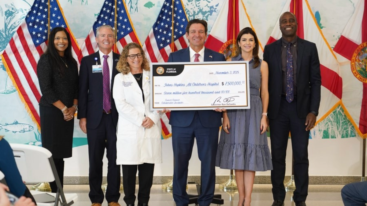 State officials present a $7.5 million grant check to Johns Hopkins All Children’s Hospital in St. Petersburg to support pediatric cancer research.