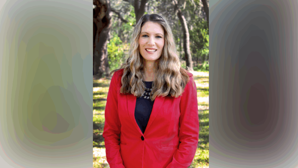 Sarah Combs, president and CEO of Metropolitan Ministries, standing outdoors in Tampa, Florida.