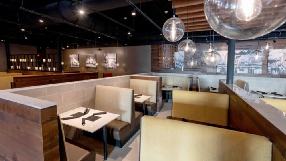 Interior dining room at the St Petersburg Melting Pot with modern booths and warm lighting