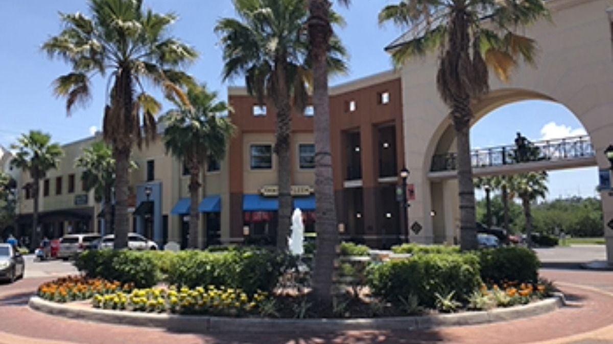 Westchase Town Center street view with shops, restaurants and palm trees