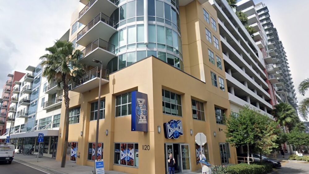Exterior view of a mixed-use residential building in Channelside with Crunch Fitness on the ground floor.