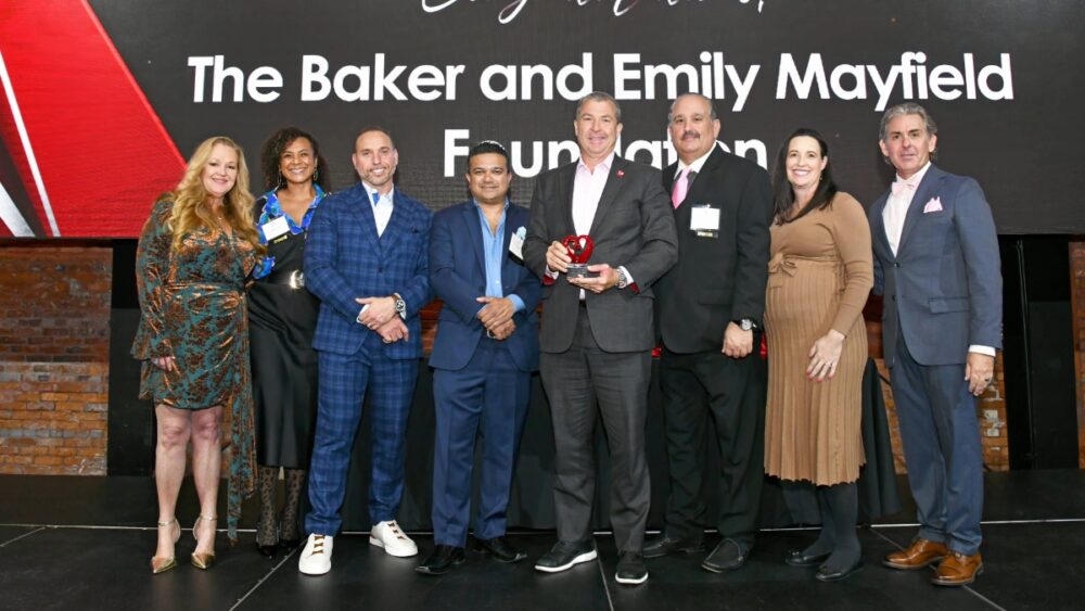 Group photo of the Baker and Emily Mayfield Foundation being honored on stage at the 2025 TBBW Philanthropists of the Year Awards.