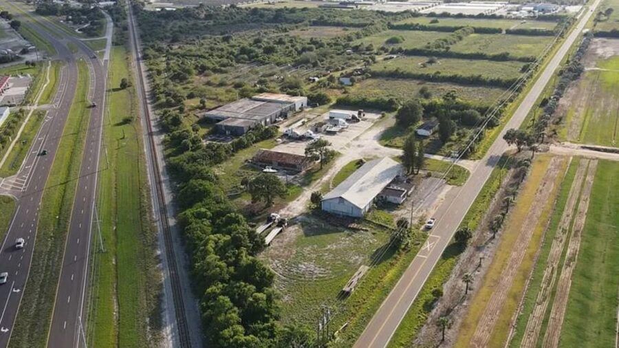 Aerial view of a 69 acre industrial site in Ruskin with warehouses, open land, road frontage and nearby rail lines.
