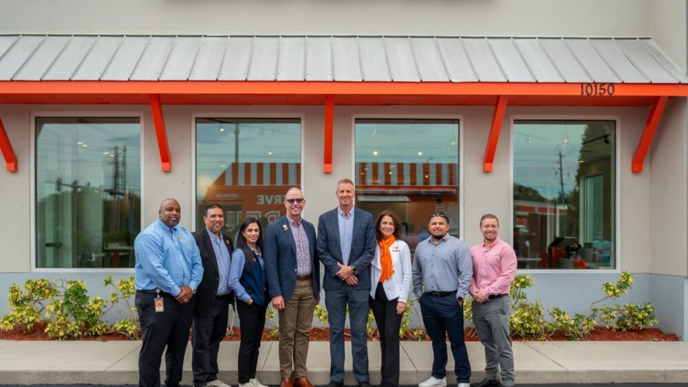 Whataburger national leadership and Largo city officials stand in front of the new restaurant site on Ulmerton Road.