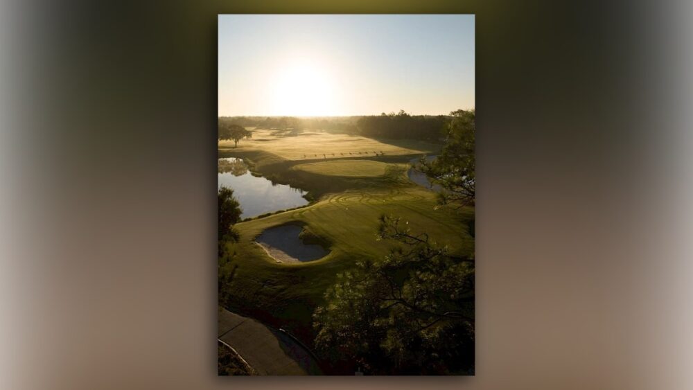 Aerial sunrise view of Saddlebrook Resort’s redesigned golf course with greens, bunkers and water features