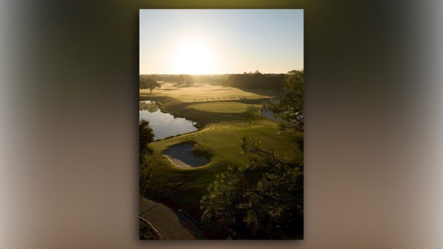 Aerial sunrise view of Saddlebrook Resort’s redesigned golf course with greens, bunkers and water features
