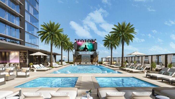 Rendering of the Hotel ORA rooftop pool deck with palm trees, cabanas, lounges and a performance stage