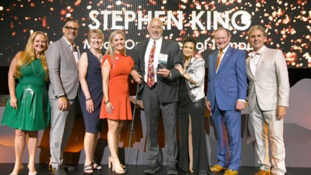 Steve King stands with fellow honorees and presenters at TBBW Apogee Awards after being named a winner.