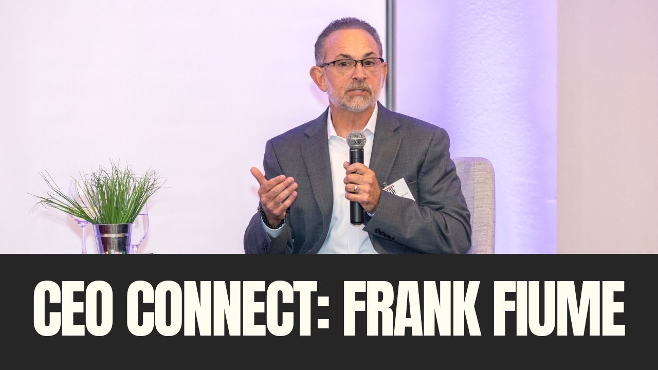 Frank Fiume speaks on stage during Tampa Bay Business & Wealth’s CEO Connect event holding a microphone