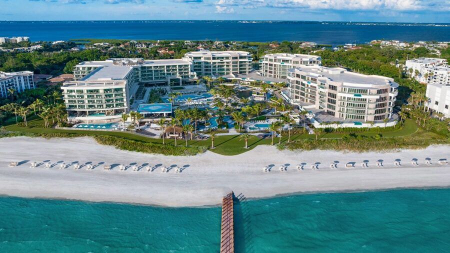 Aerial view of the St. Regis Longboat Key pools and lagoon with the Gulf of Mexico in the background.