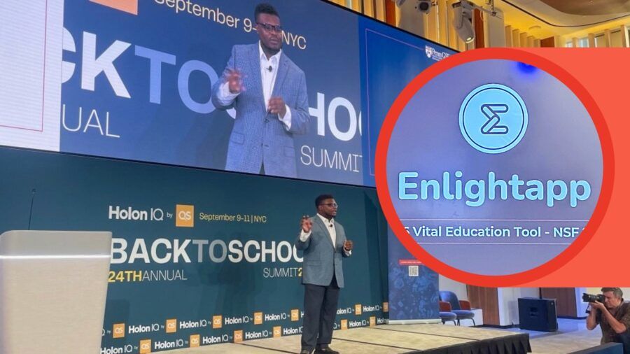 Dieumerci Christel sitting in a conference room wearing an NDSU sweatshirt while working on Enlightapp.