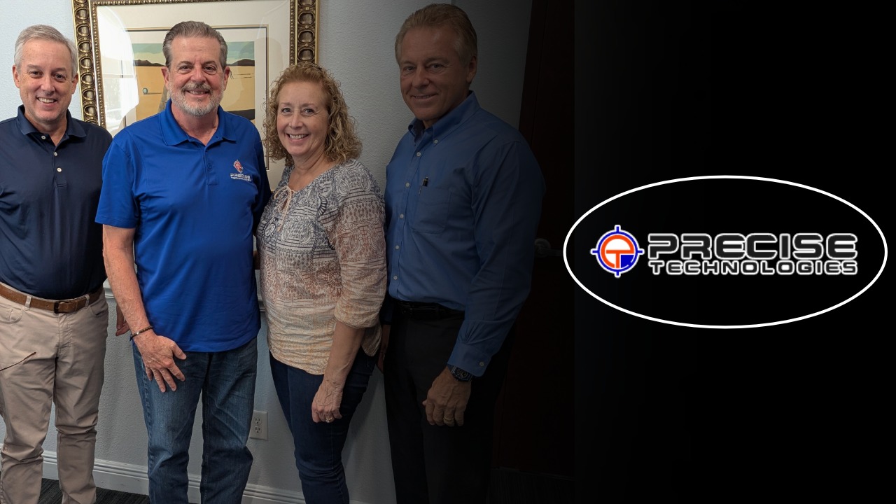 Todd Kuykendall, Dave Schwanke, Tara Schwanke and Edward Valaitis stand together following the sale of Precise Technologies Inc. in Largo.