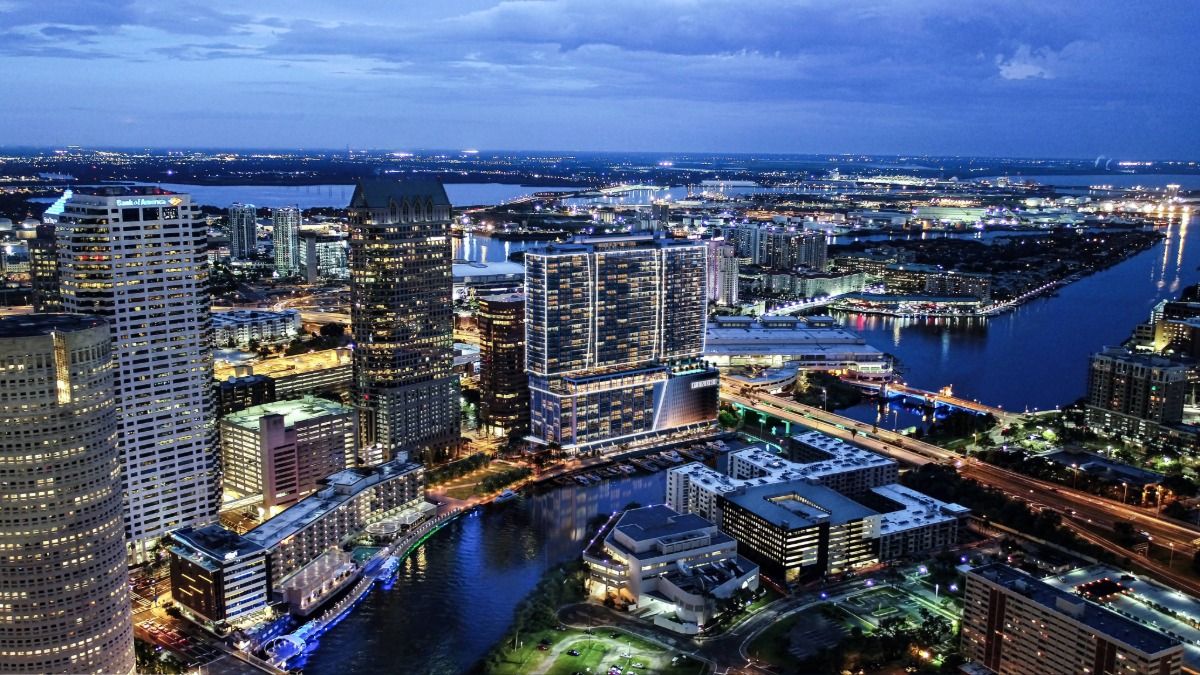 An aerial view of Pendry Tampa along the Riverwalk at dusk