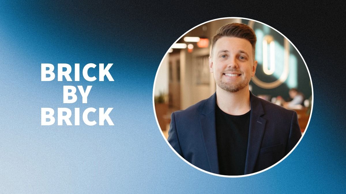Professional headshot of Jake Kurtz smiling in a navy blazer, placed inside a circular frame on a blue gradient background with the words “Brick By Brick” in bold white text.