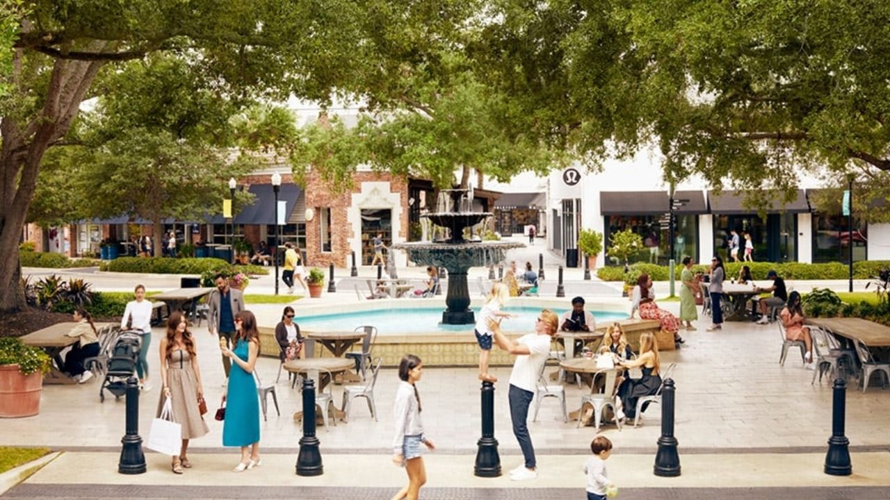 Shoppers and diners gather around the central fountain at Hyde Park Village in Tampa