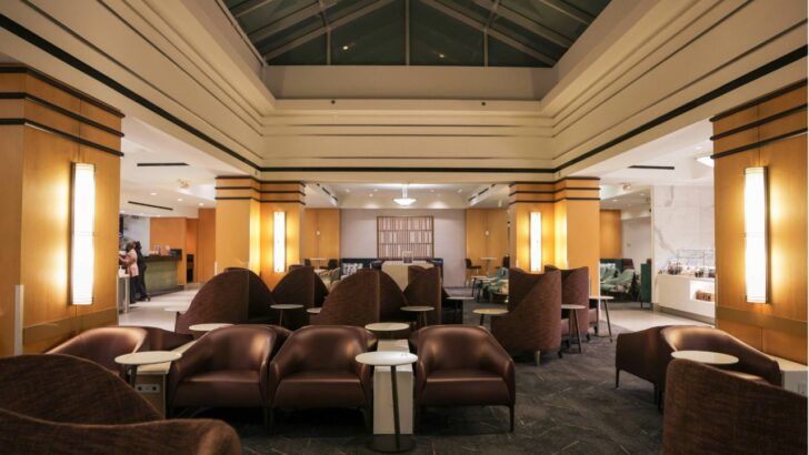 Interior view of a renovated Delta Sky Club lounge showing expanded seating and open gathering areas at a major U.S. airport.