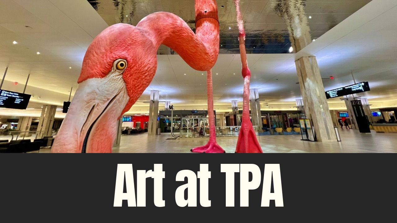 Large pink flamingo sculpture inside Tampa International Airport terminal