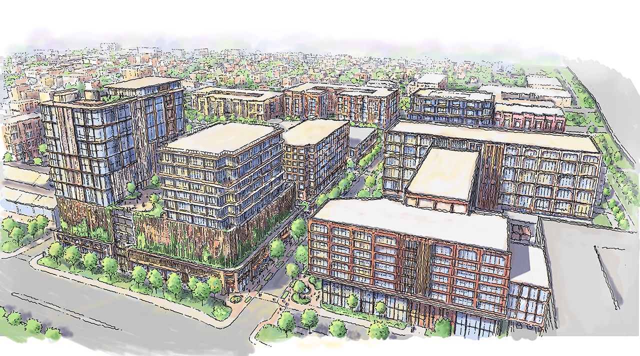 Artist rendering of a proposed mixed-use development in East Ybor City showing residential and commercial buildings across multiple city blocks.