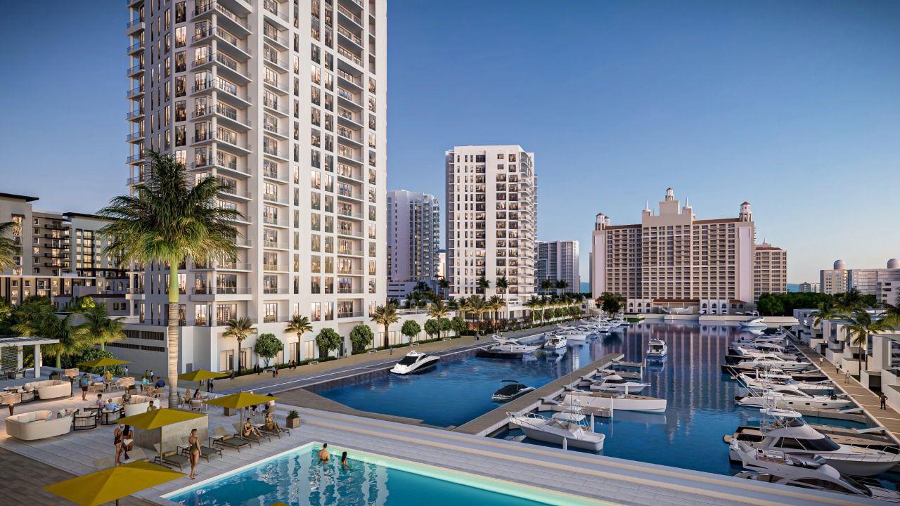 Rendering of The Ritz-Carlton Residences, Sarasota Bay overlooking a marina with boats, waterfront pool deck and high-rise towers in Sarasota.