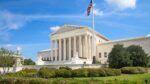 U.S. Supreme Court building in Washington, D.C., with American flag flying above the columns