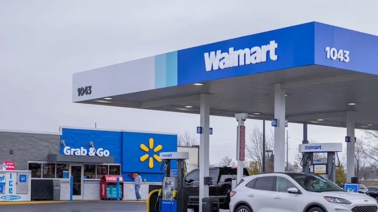 Walmart fuel station with multiple gas pumps and convenience store under blue Walmart canopy