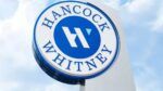 Hancock Whitney bank sign outside branch location