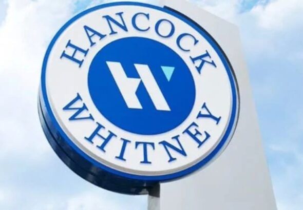 Hancock Whitney bank sign outside branch location