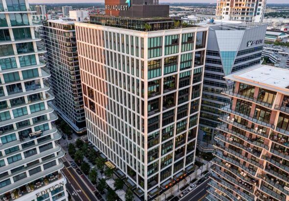 Aerial view of Thousand & One office tower at Water Street Tampa in downtown Tampa.